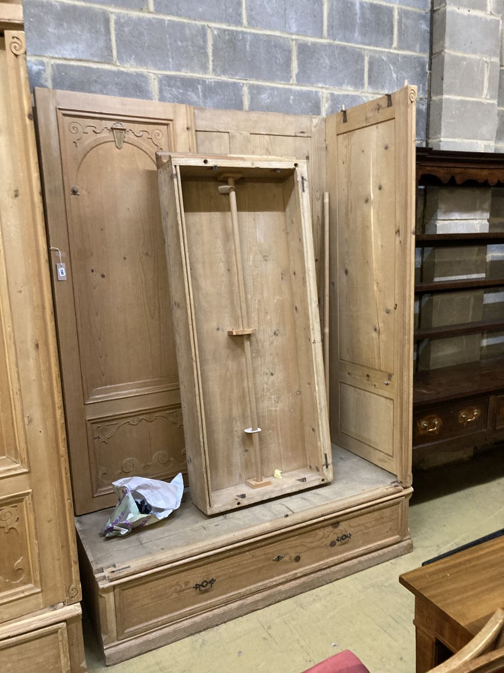 A 19th century French pine two door knockdown wardrobe with drawer and base, width 158cm depth 66cm height 234cm